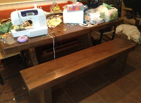 Here is the bench next to the table I refinished. It fit perfectly. And having a bench is cool. My daughter likes it and the table gets a lot more use now. 